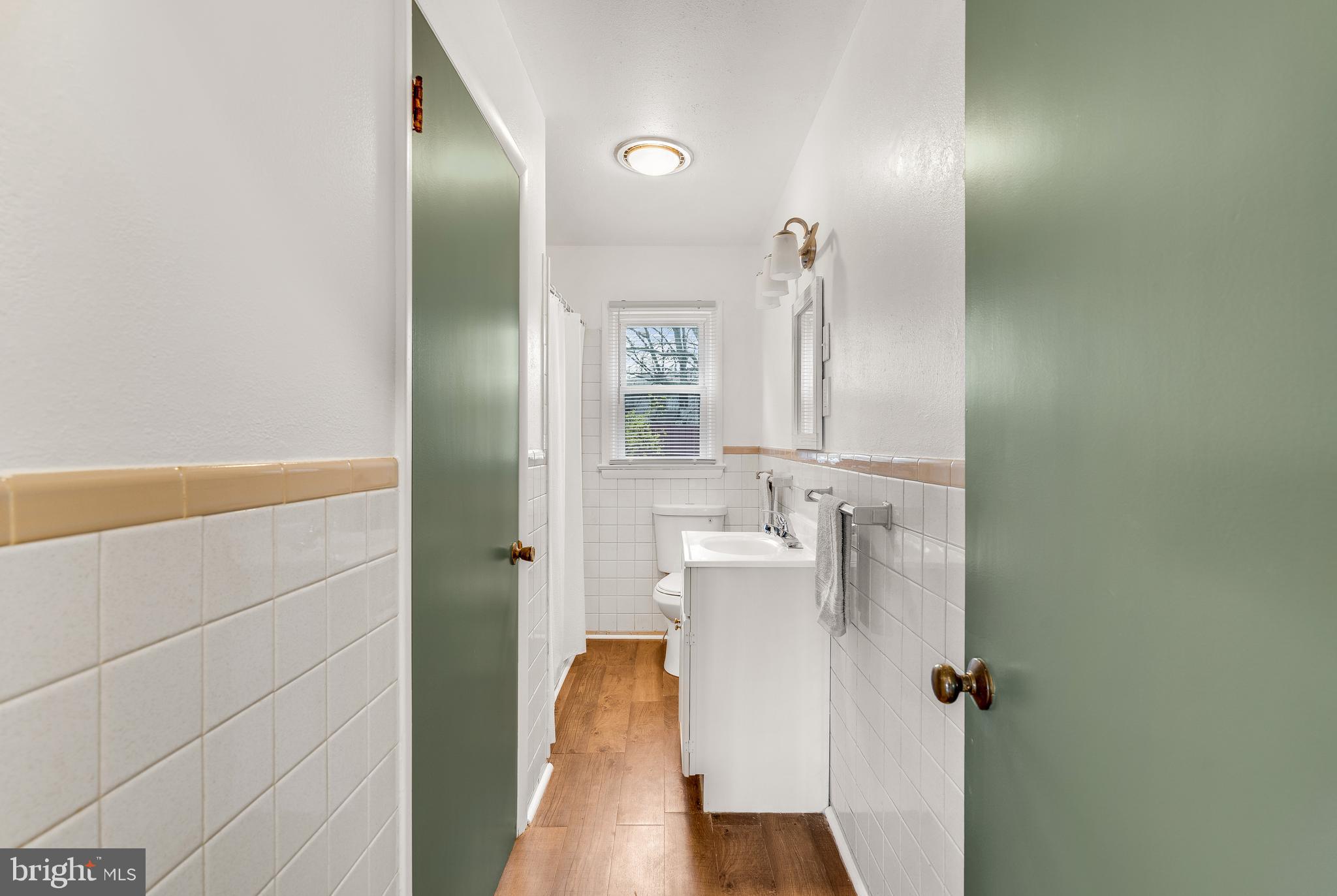 310 North Fairfax Boulevard Ranson, WV 25438 - Photo 10 of 36 a bathroom with a sink and mirror