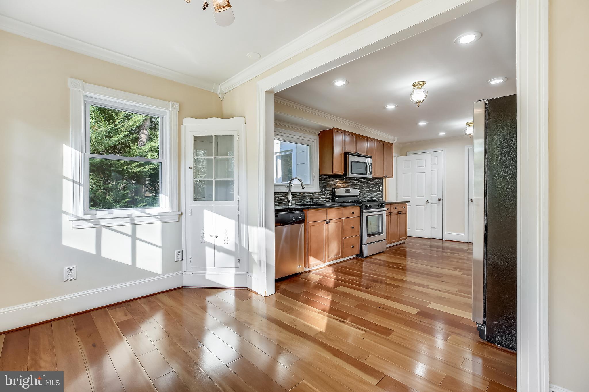 411 Baltimore Road Rockville, MD 20850 - Photo 11 of 48 Brkfst-Rm/SunRm leads to new DECK*Gazebo*Garage
