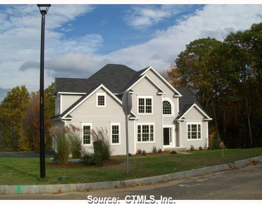 a view of white house with a yard