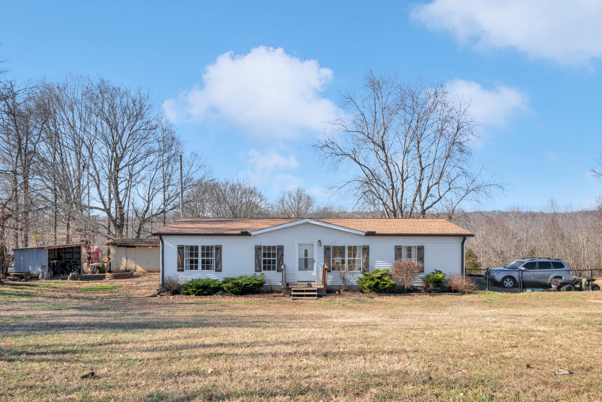 1169 Saddle Tree Road Ashland City, TN 37015 - Photo 1 of 29 a front view of a house with a yard