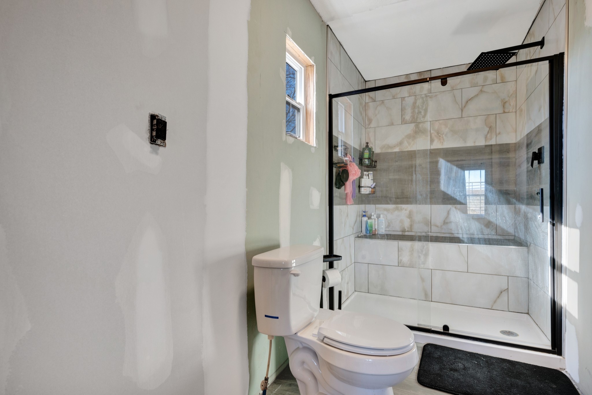 1169 Saddle Tree Road Ashland City, TN 37015 - Photo 14 of 29 a bathroom with a toilet and a shower