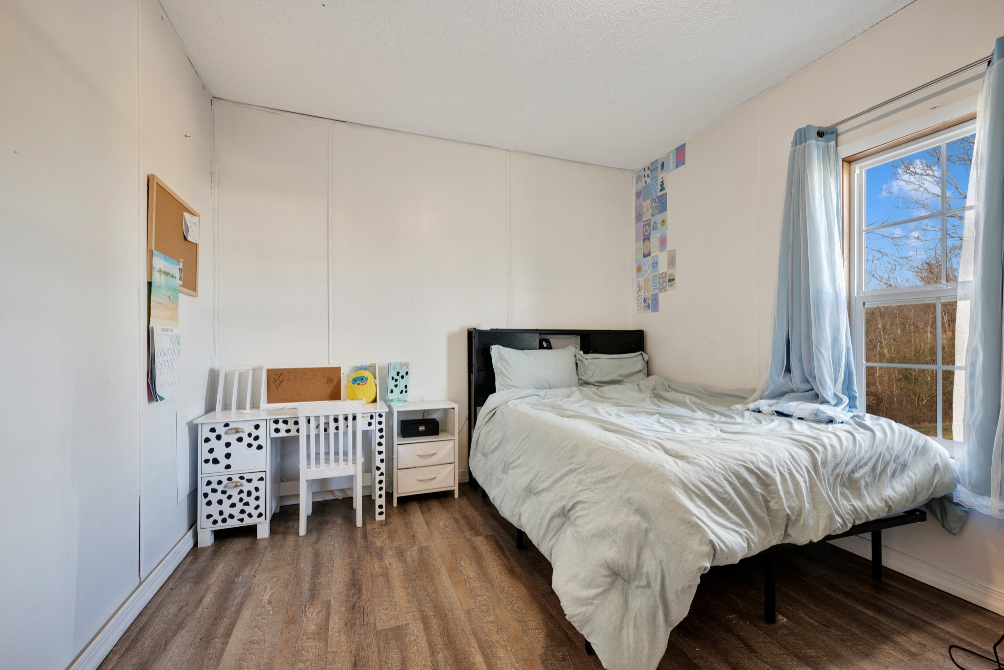 1169 Saddle Tree Road Ashland City, TN 37015 - Photo 20 of 29 a bedroom with a bed and wooden floor
