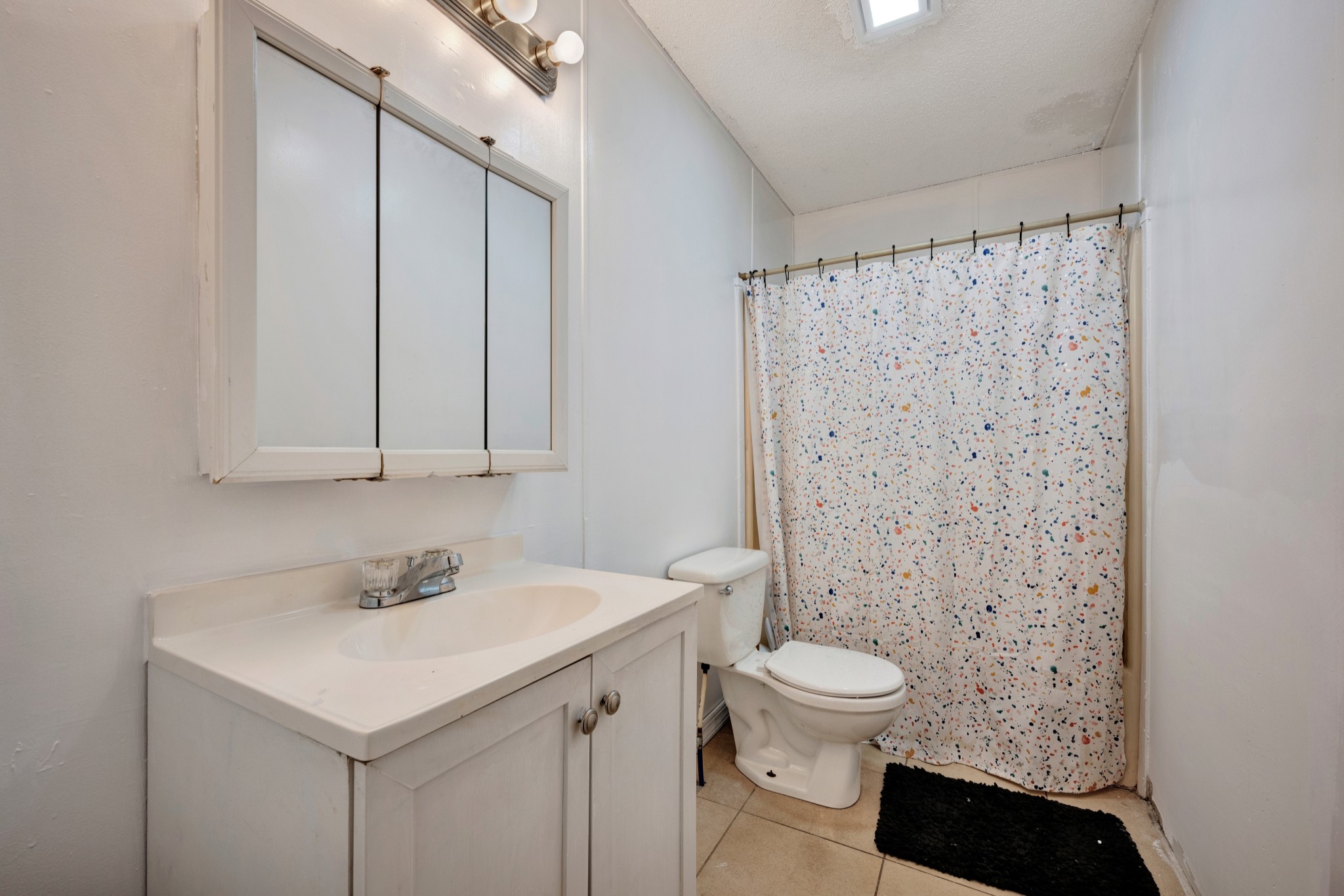 1169 Saddle Tree Road Ashland City, TN 37015 - Photo 21 of 29 a bathroom with a sink toilet and shower
