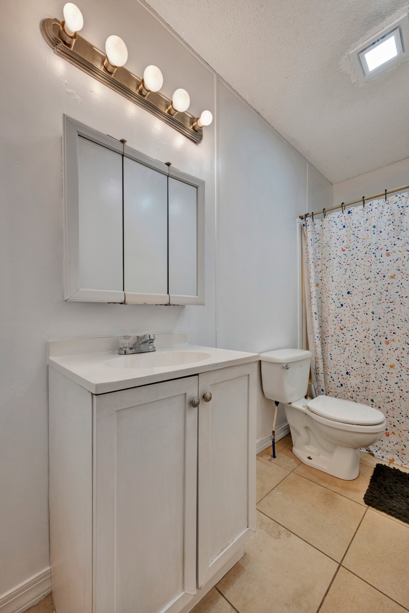 1169 Saddle Tree Road Ashland City, TN 37015 - Photo 22 of 29 a bathroom with a sink a toilet and mirror