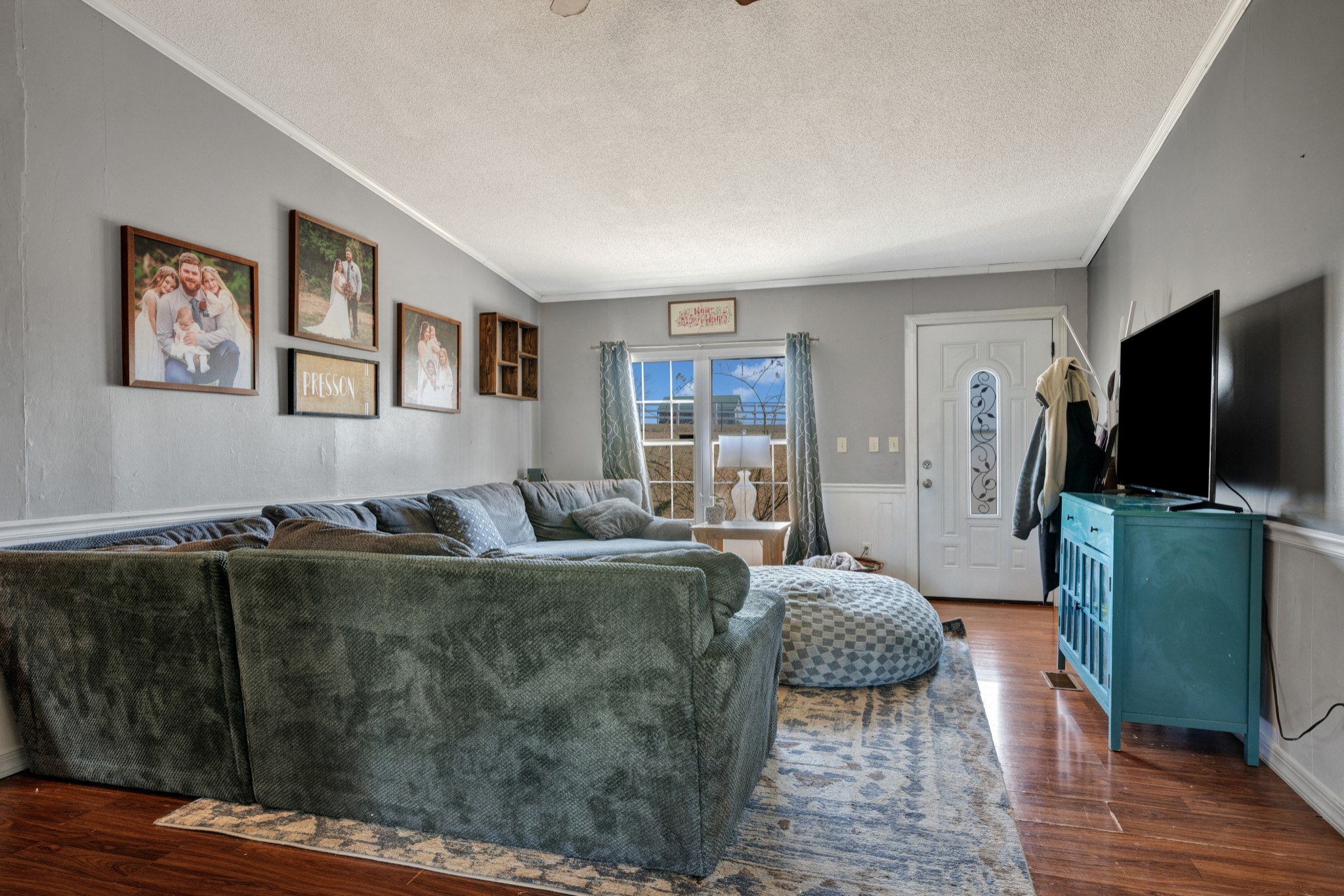 1169 Saddle Tree Road Ashland City, TN 37015 - Photo 7 of 29 a living room with furniture and a flat screen tv