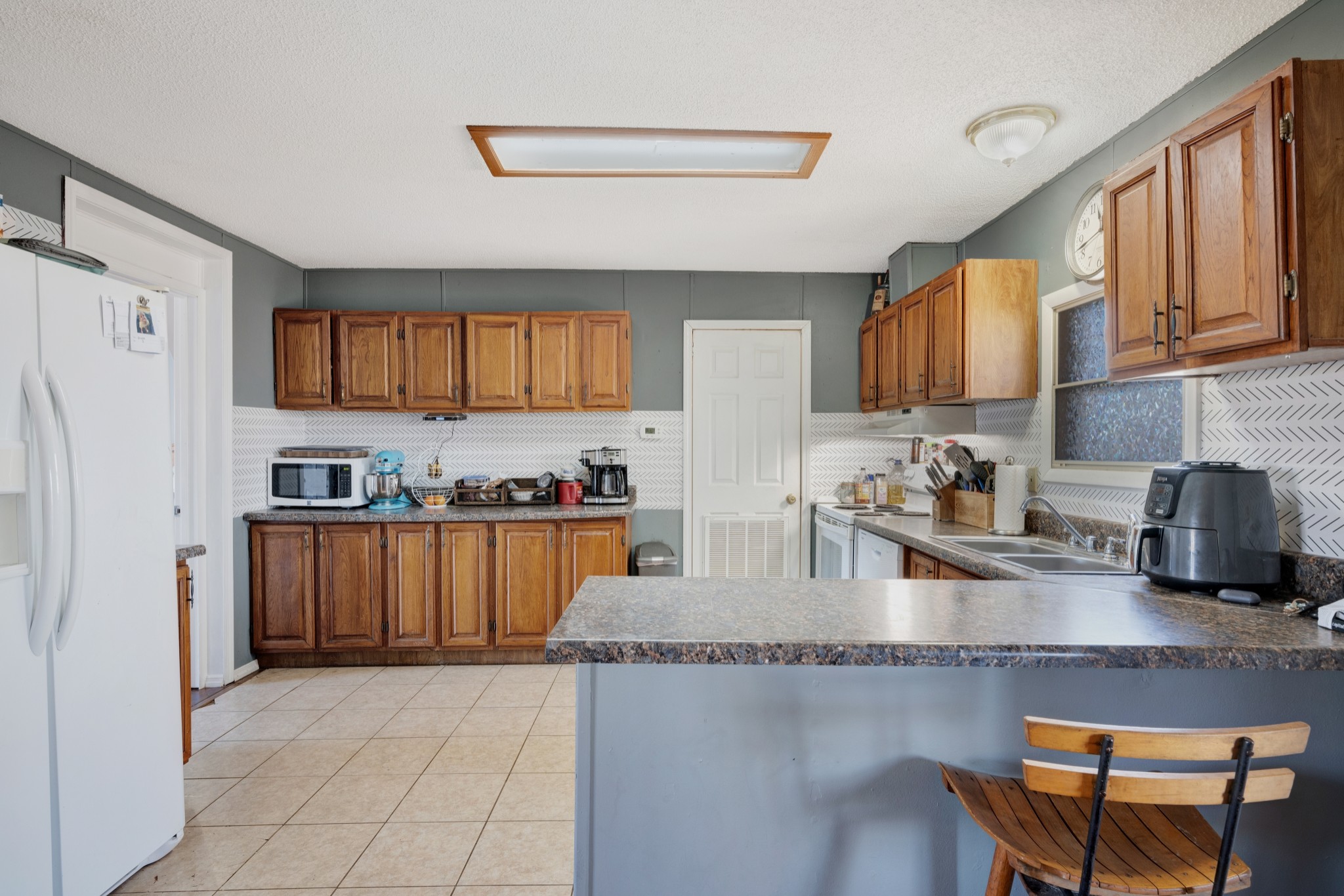 1169 Saddle Tree Road Ashland City, TN 37015 - Photo 8 of 29 a kitchen with stainless steel appliances granite countertop a refrigerator sink and cabinets