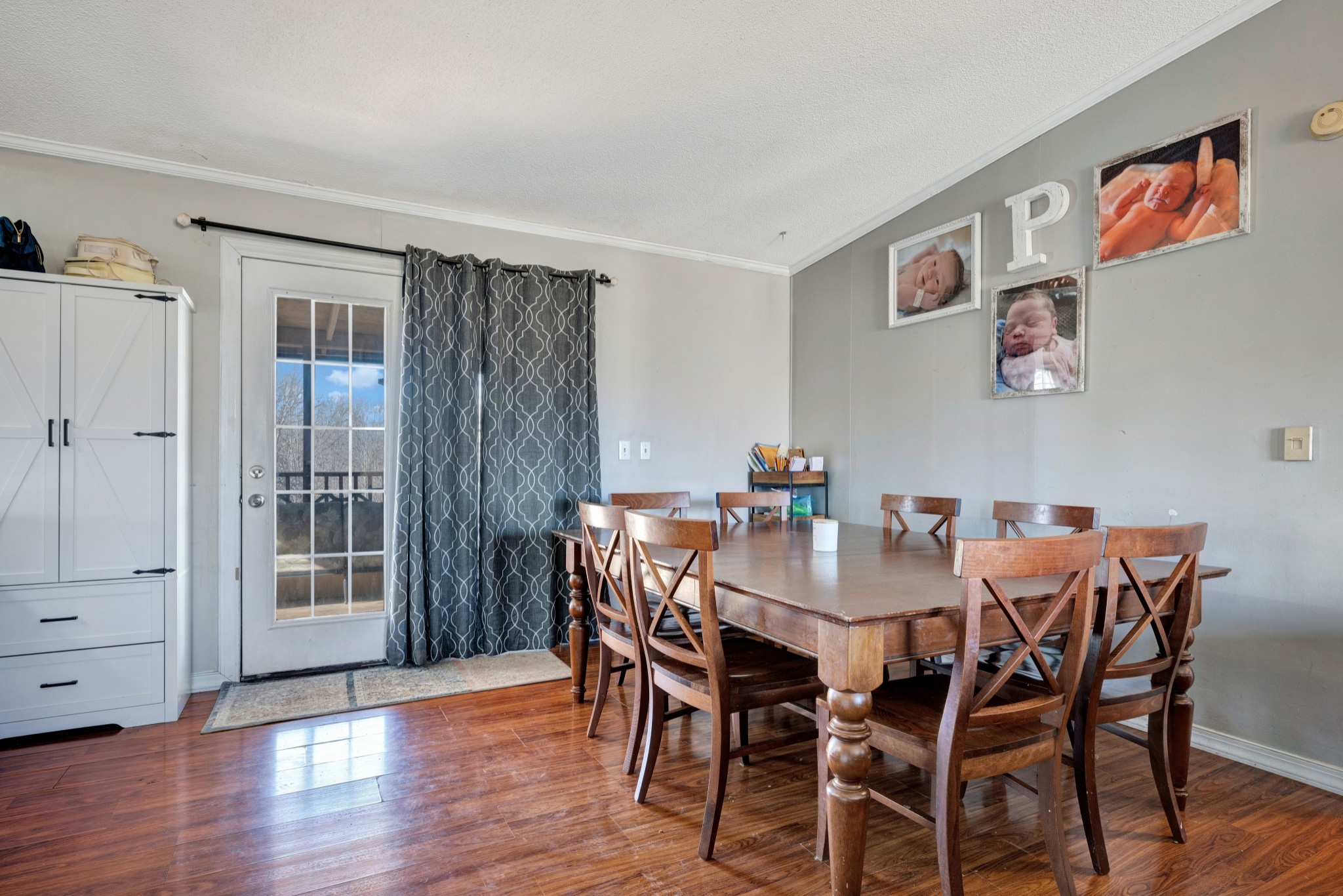 1169 Saddle Tree Road Ashland City, TN 37015 - Photo 10 of 29 a view of a dining room with furniture and wooden floor