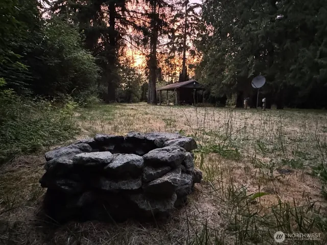 a backyard of a house with lots of green space