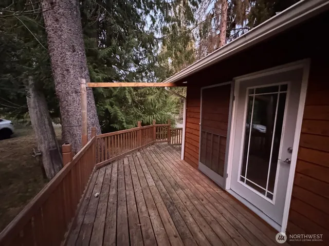 a view of balcony with wooden floor