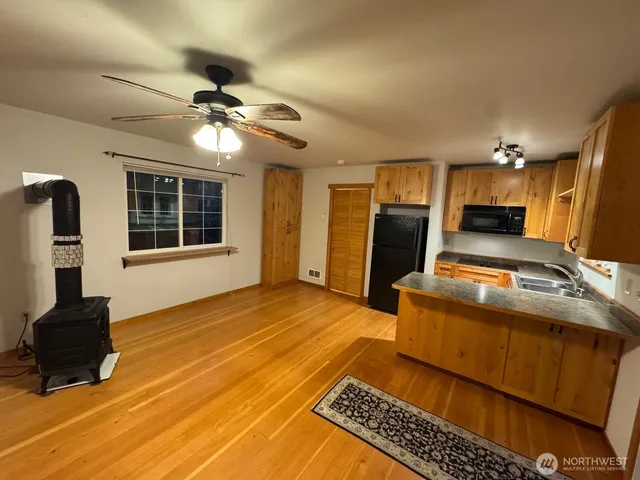 a kitchen with sink and refrigerator