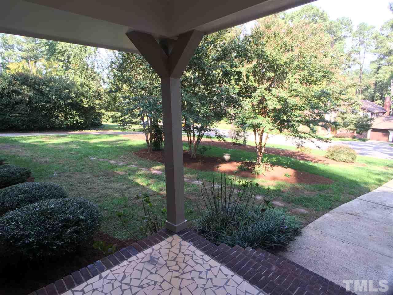 3105 Braddock Drive Raleigh, NC 27612 - Photo 3 of 19 a view of a yard with a tree