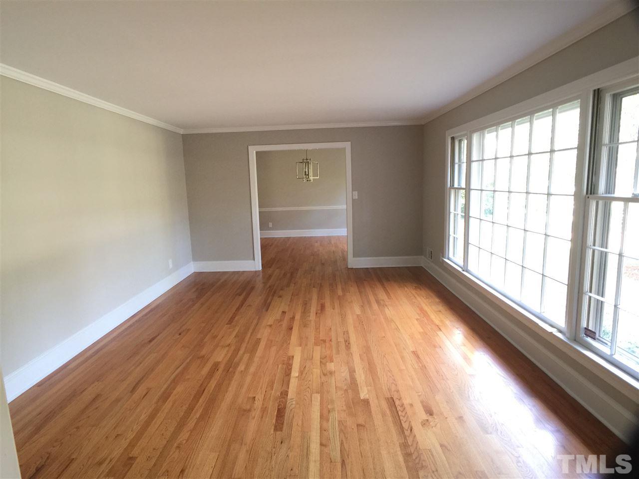 3105 Braddock Drive Raleigh, NC 27612 - Photo 6 of 19 wooden floor in an empty room with a window