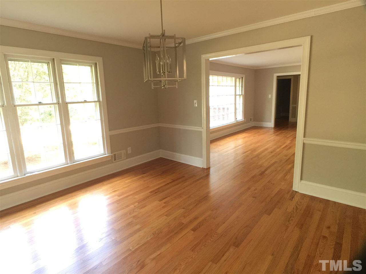 3105 Braddock Drive Raleigh, NC 27612 - Photo 7 of 19 a view of empty room with wooden floor and fan