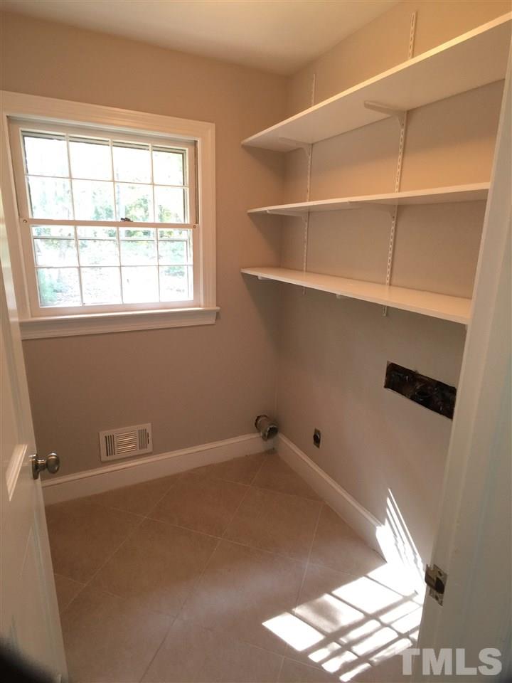 3105 Braddock Drive Raleigh, NC 27612 - Photo 8 of 19 an empty room with a window