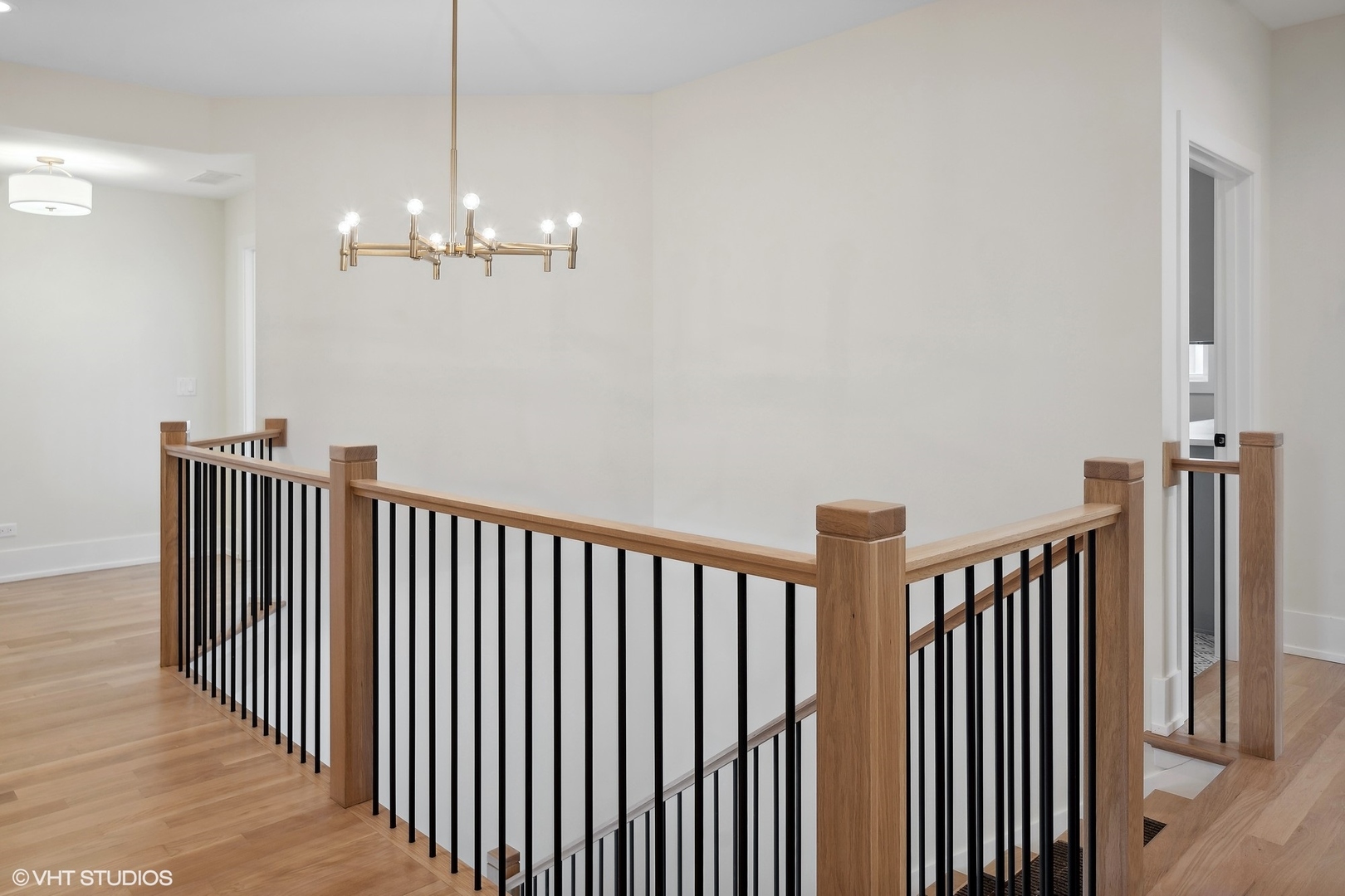 191 Rex Boulevard Elmhurst, IL 60126 - Photo 16 of 20 a view of a hallway with wooden floor and staircase