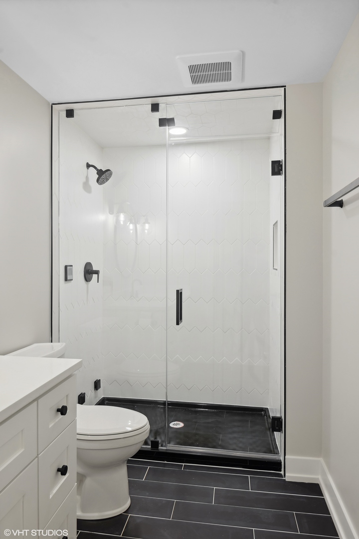 191 Rex Boulevard Elmhurst, IL 60126 - Photo 17 of 20 a bathroom with a sink a toilet and shower