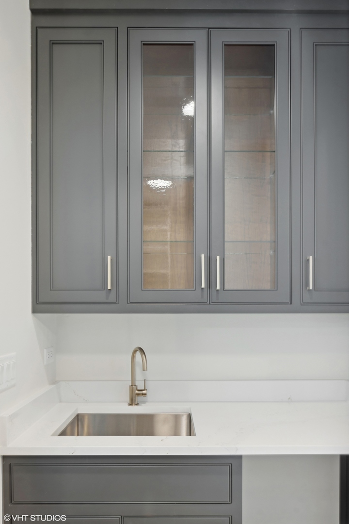 191 Rex Boulevard Elmhurst, IL 60126 - Photo 10 of 20 a close view of sink cabinets and a wooden floor