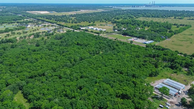 an aerial view of city with lush greenery space