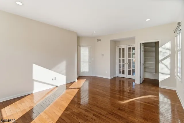 a bathroom with a double vanity sink mirror and shower