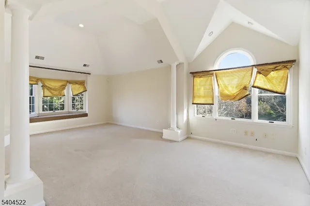 a bathroom with a granite countertop toilet and a shower