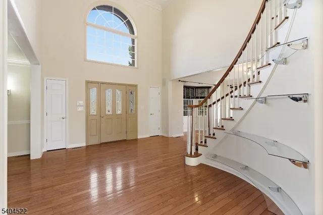 a view of an entryway with wooden floor