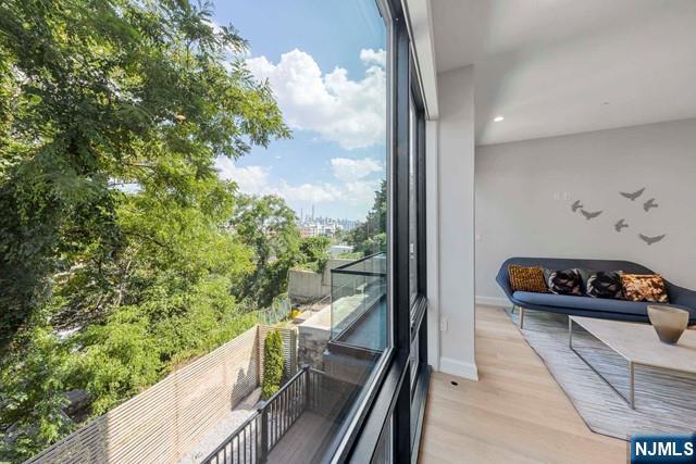 8824 Churchill Road North Bergen, NJ 07047 - Photo 12 of 50 a balcony with wooden floor