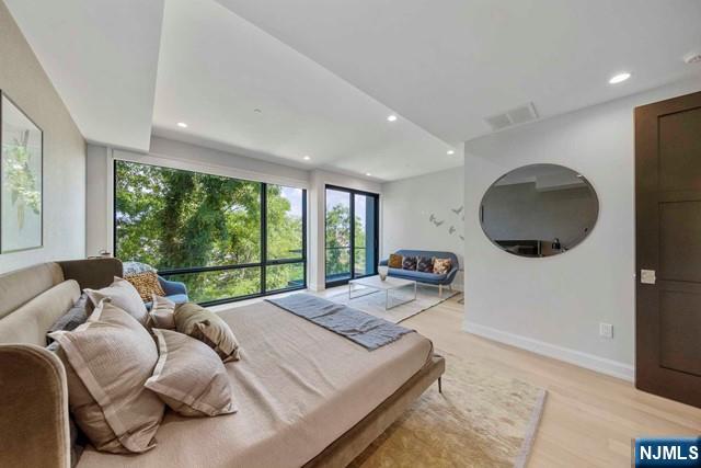 8824 Churchill Road North Bergen, NJ 07047 - Photo 14 of 50 a bed room with a bed and a painting