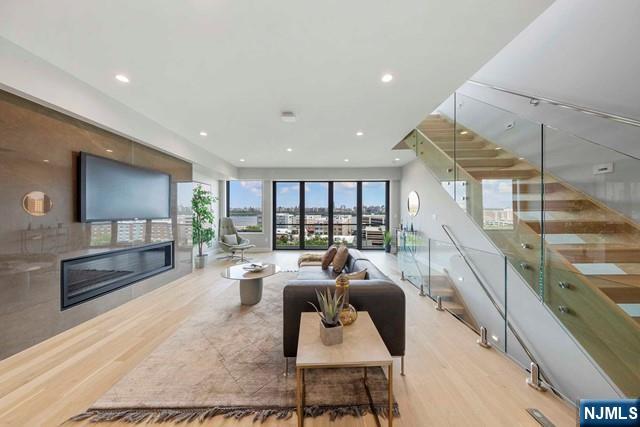 8824 Churchill Road North Bergen, NJ 07047 - Photo 32 of 50 a living room with furniture and a flat screen tv