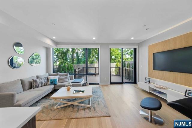 8824 Churchill Road North Bergen, NJ 07047 - Photo 8 of 50 a living room with furniture and a flat screen tv