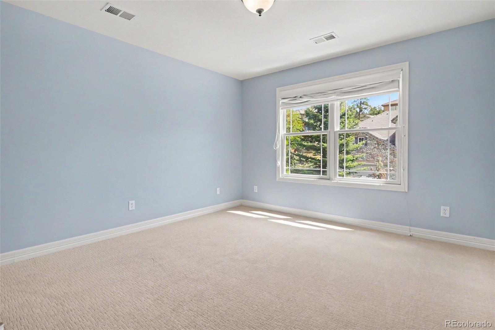 791 Elk Rest Road Evergreen, CO 80439 - Photo 28 of 46 an empty room with windows