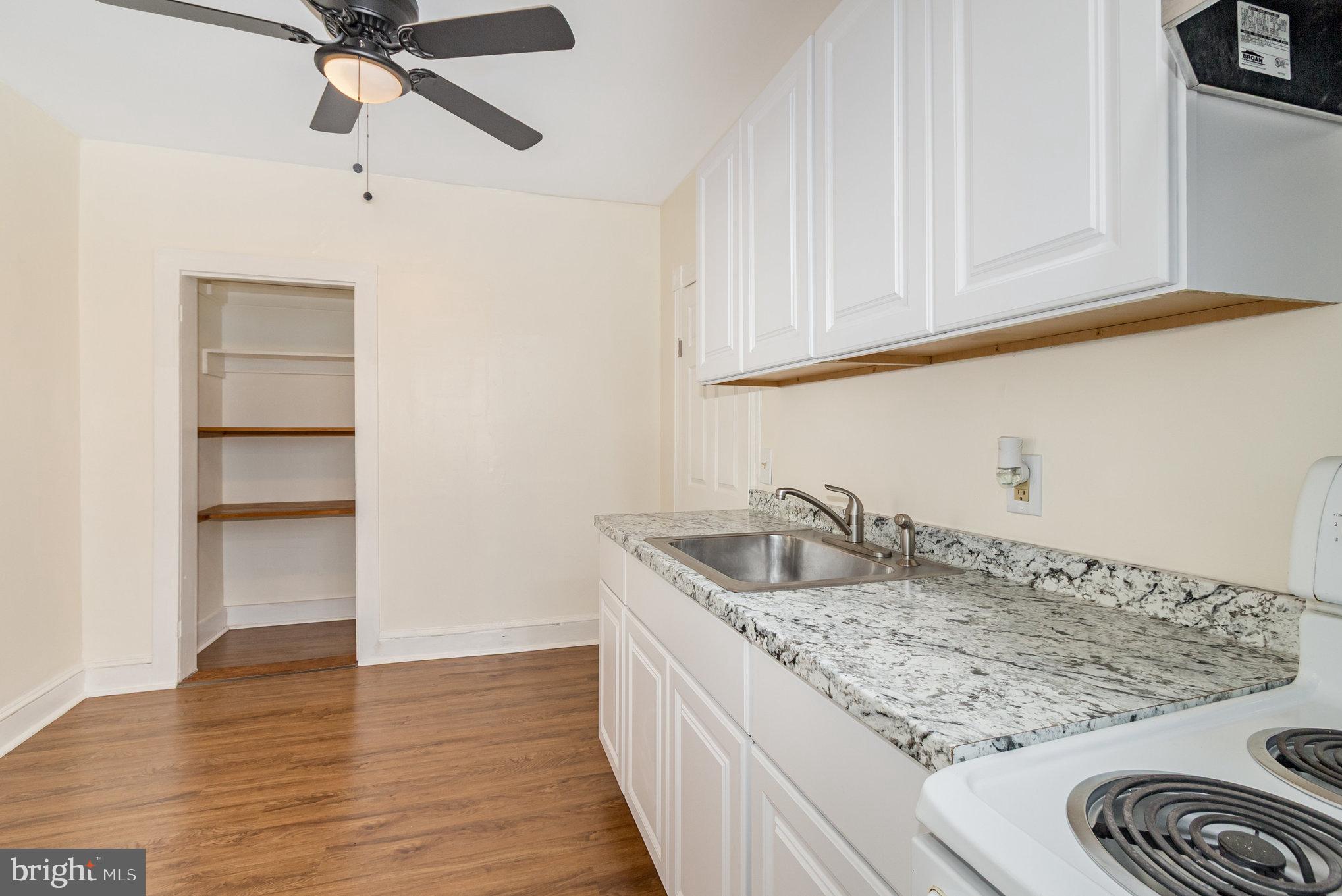 517 High Street Chestertown, MD 21620 - Photo 11 of 51 a kitchen with a sink and cabinets