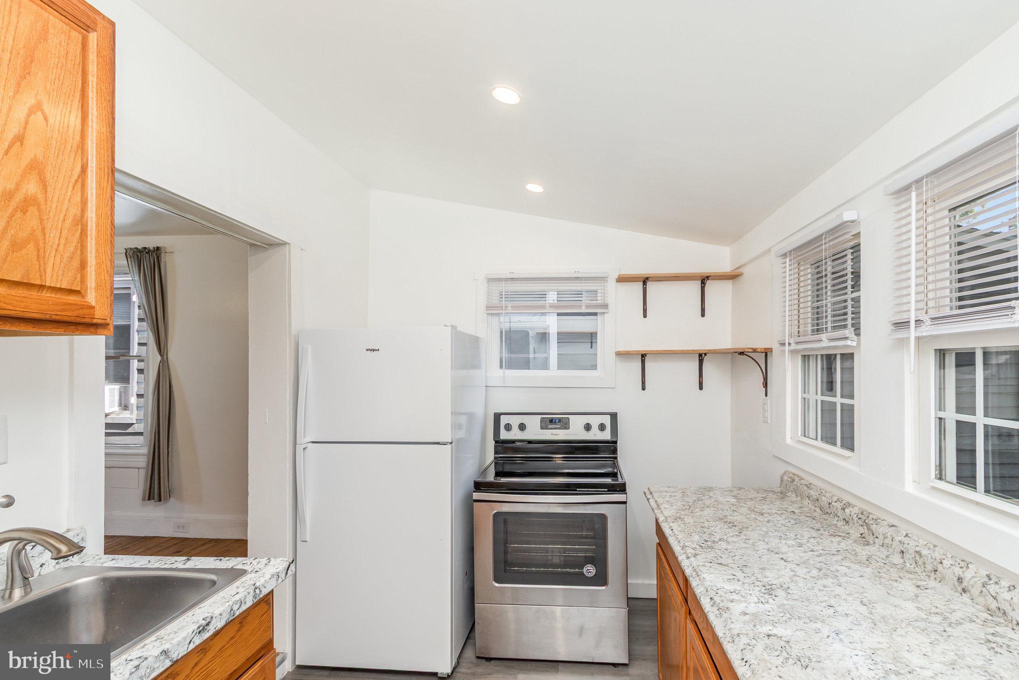 517 High Street Chestertown, MD 21620 - Photo 19 of 51 a kitchen with stainless steel appliances granite countertop a sink stove and refrigerator