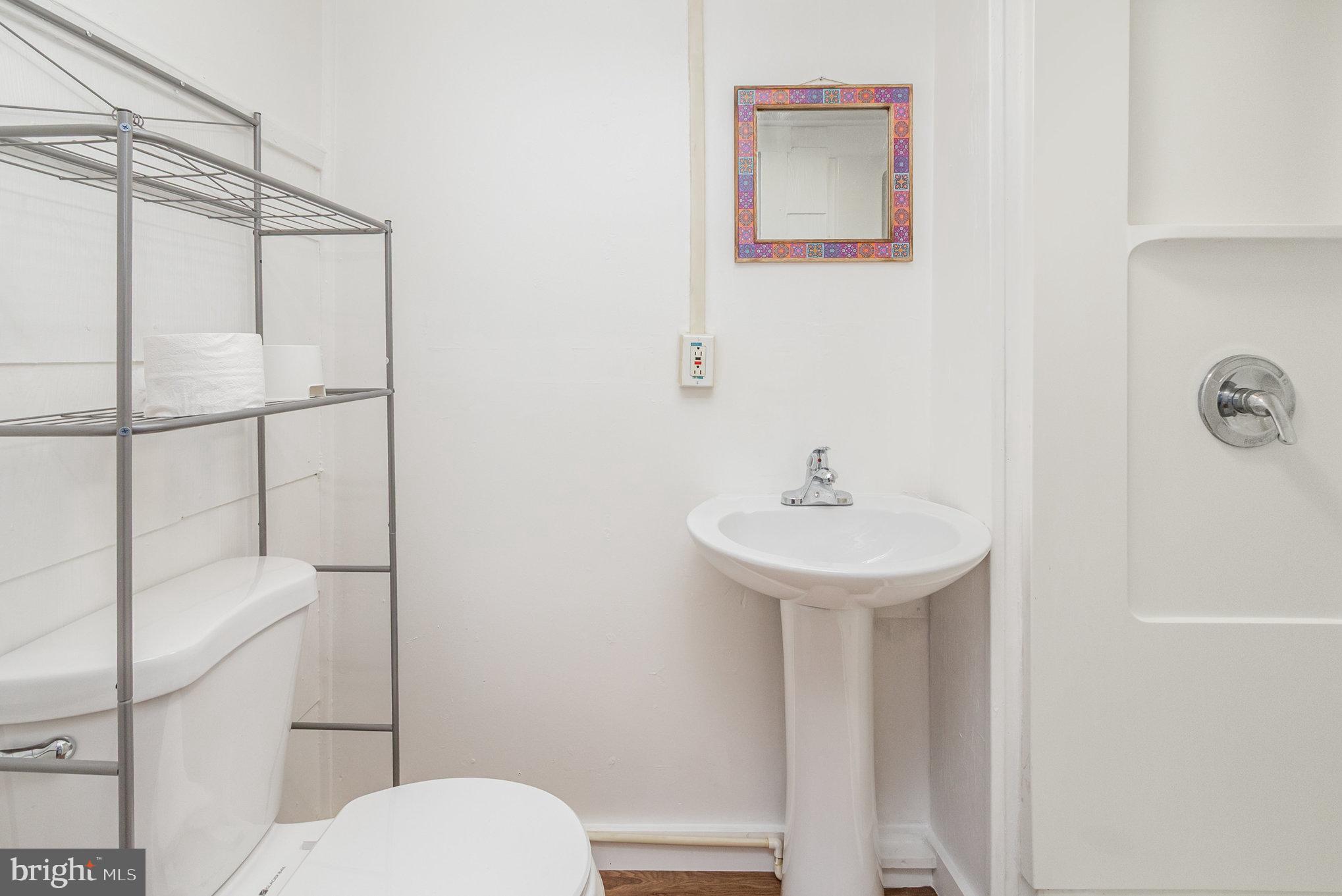 517 High Street Chestertown, MD 21620 - Photo 23 of 51 a bathroom with a sink a toilet and shower