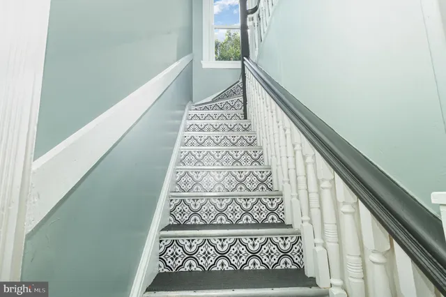 a view of a balcony with wooden floor and a window