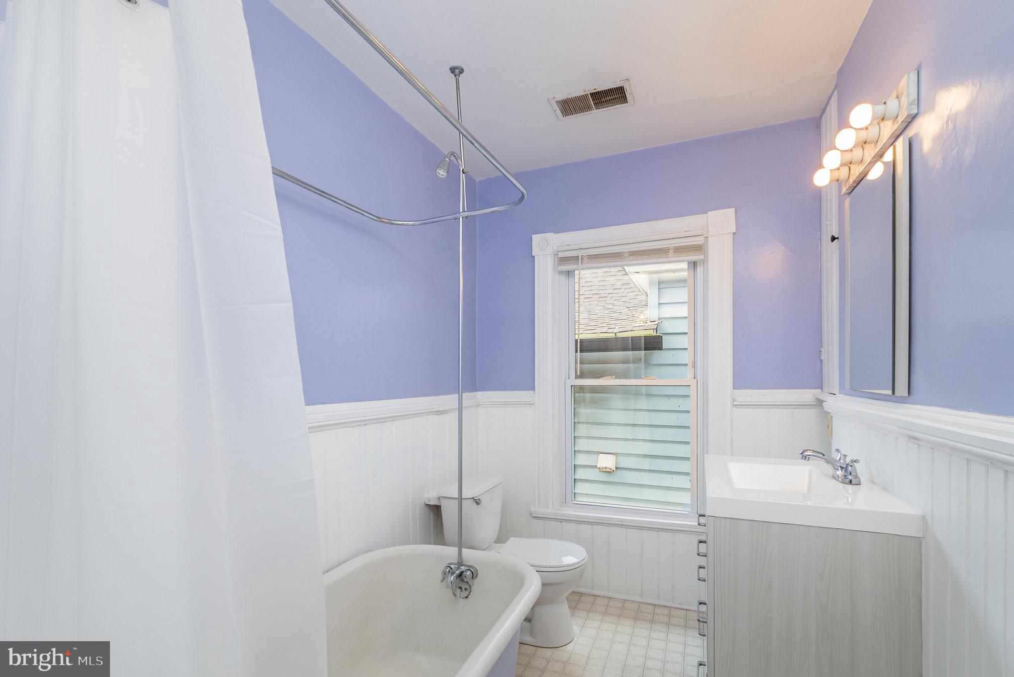 517 High Street Chestertown, MD 21620 - Photo 28 of 51 a bathroom with a sink a tub and a mirror