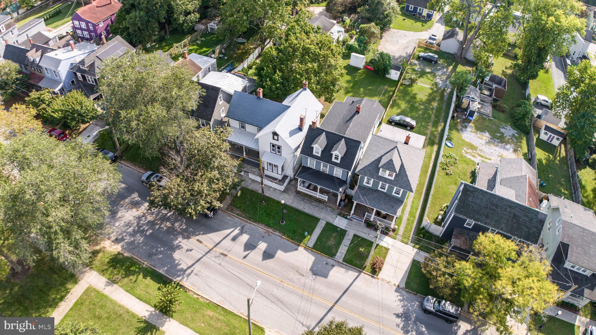 517 High Street Chestertown, MD 21620 - Photo 44 of 51 an aerial view of a house with a yard and outdoor seating