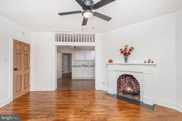a view of washer and dryer with kitchen in the background