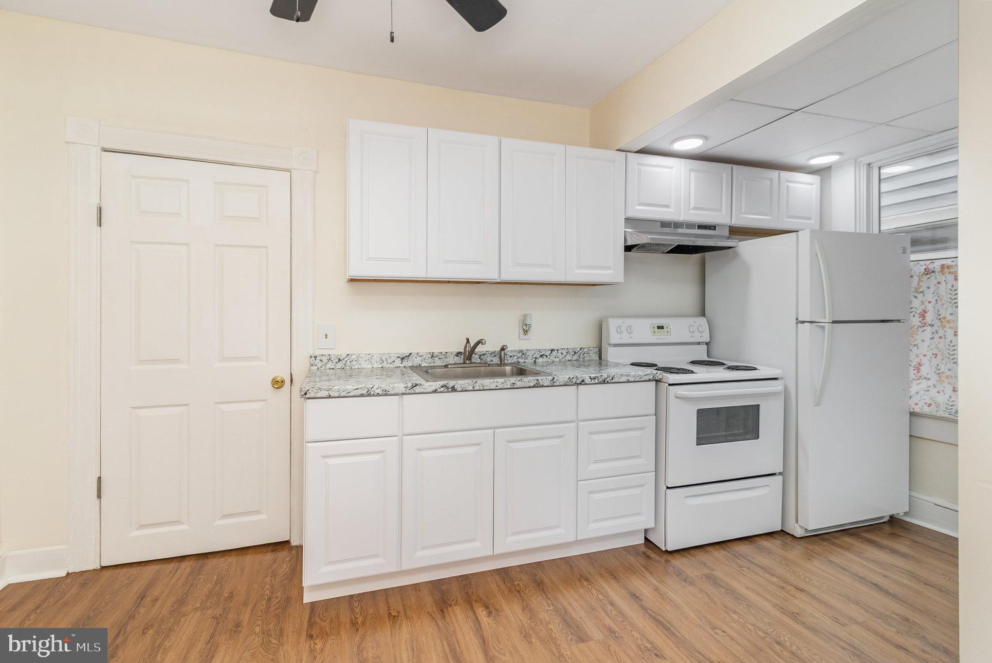 517 High Street Chestertown, MD 21620 - Photo 10 of 51 a kitchen with stainless steel appliances granite countertop a stove a sink and a refrigerator