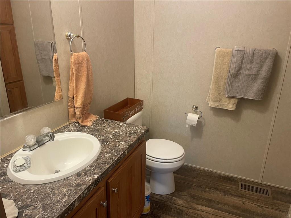 14624 Gilliland Road Linesville, PA 16424 - Photo 20 of 23 a bathroom with a granite countertop sink and a mirror