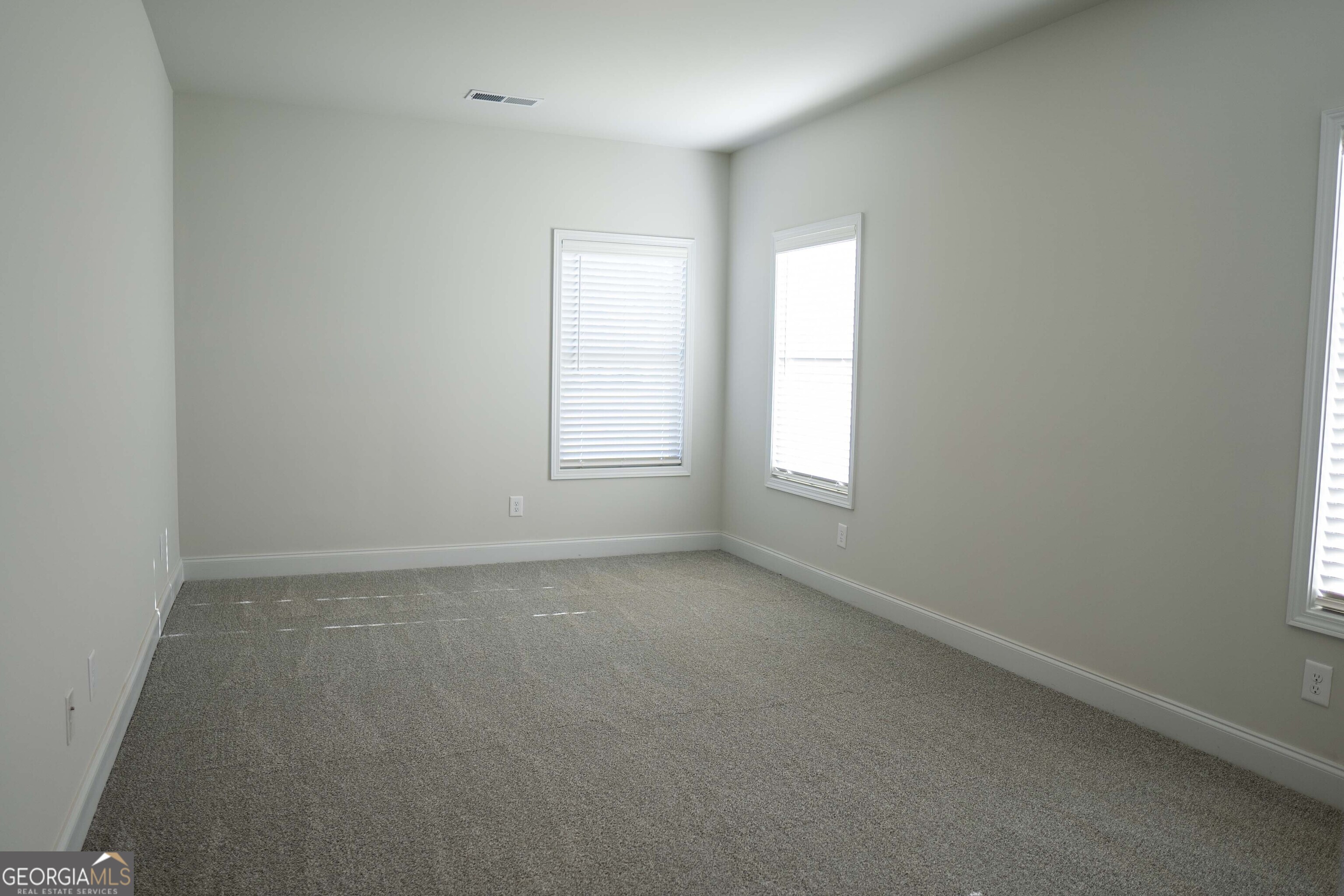 600 Beaver Court Perry, GA 31069 - Photo 21 of 48 an empty room with windows