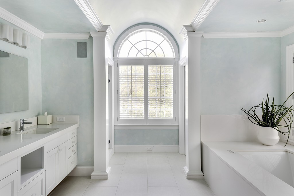 18 Meadowbrook Road Weston, MA 02493 - Photo 12 of 29 a bathroom with a sink a large mirror and a bathtub