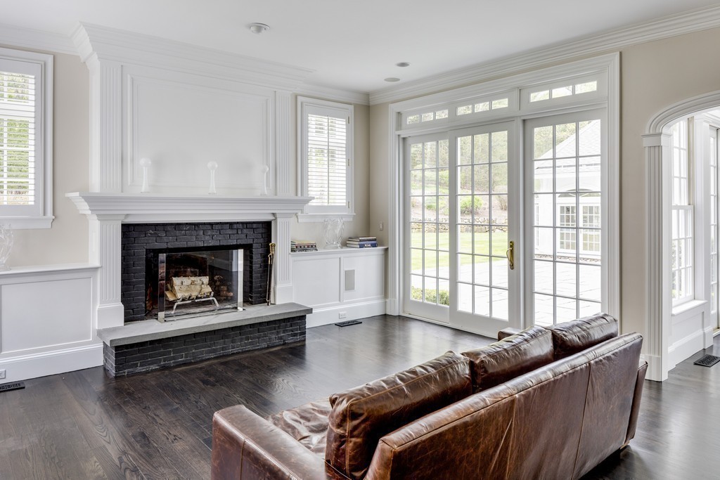 18 Meadowbrook Road Weston, MA 02493 - Photo 16 of 29 a living room with furniture and a fireplace