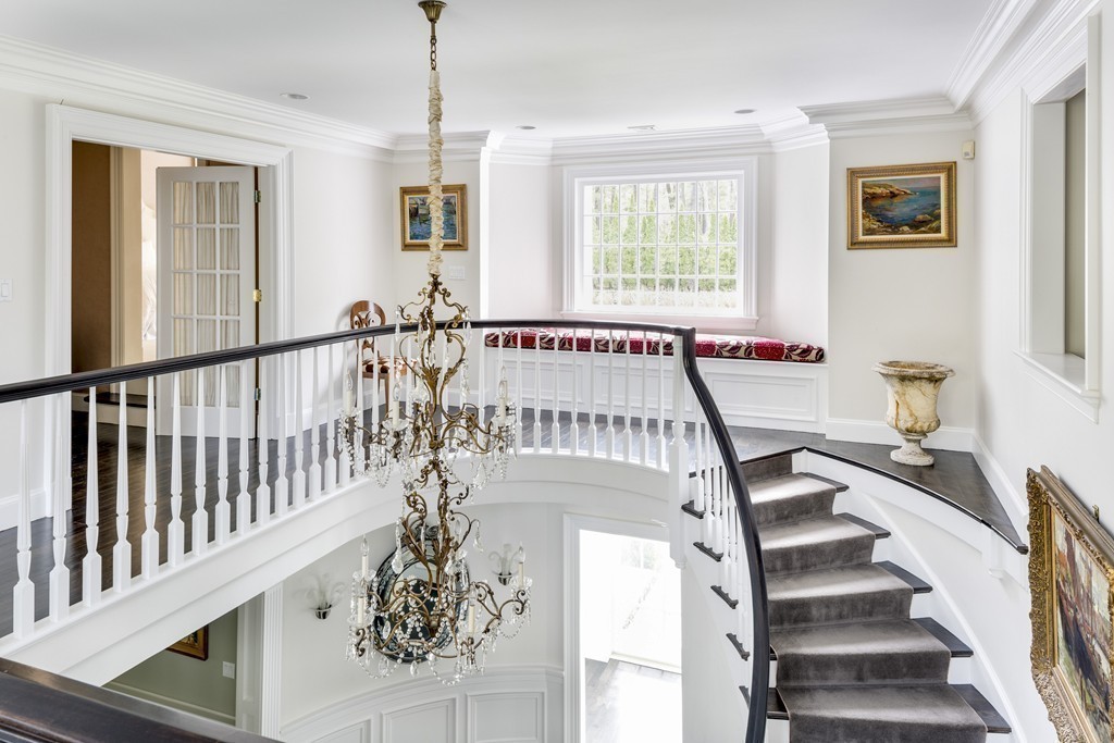 18 Meadowbrook Road Weston, MA 02493 - Photo 20 of 29 a view of entryway with wooden floor and windows