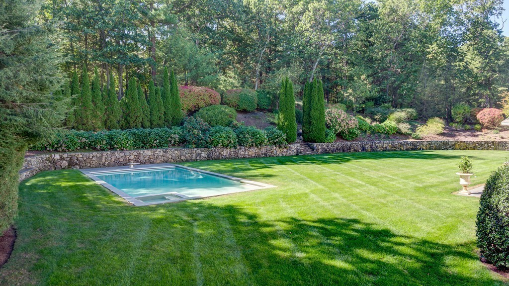 18 Meadowbrook Road Weston, MA 02493 - Photo 21 of 29 a view of a swimming pool and a yard