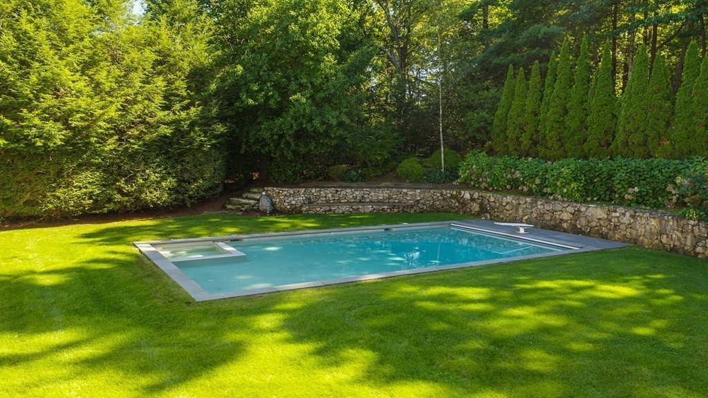 18 Meadowbrook Road Weston, MA 02493 - Photo 24 of 29 a view of a swimming pool with a yard
