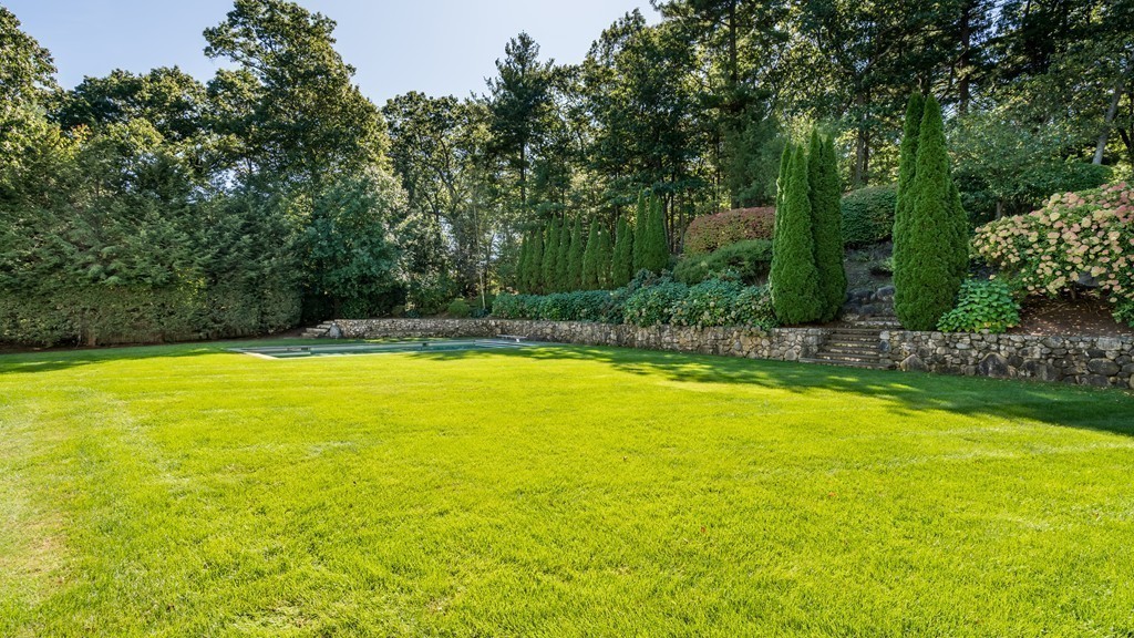 18 Meadowbrook Road Weston, MA 02493 - Photo 25 of 29 a view of a swimming pool with an outdoor space and seating area