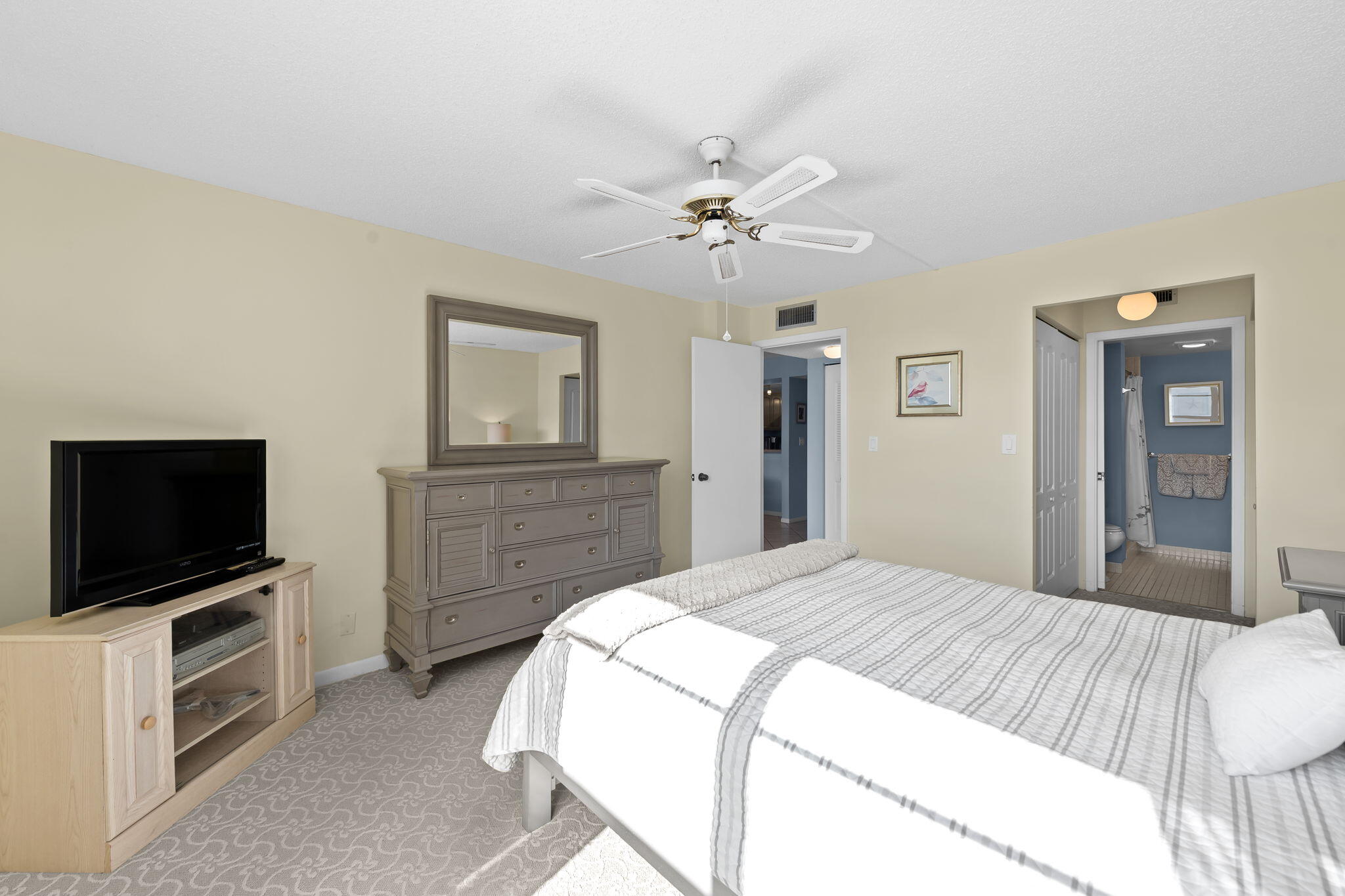 15 Royal Palm Way, Unit 505 Boca Raton, FL 33432 - Photo 13 of 32 a bedroom with a bed and a flat screen tv