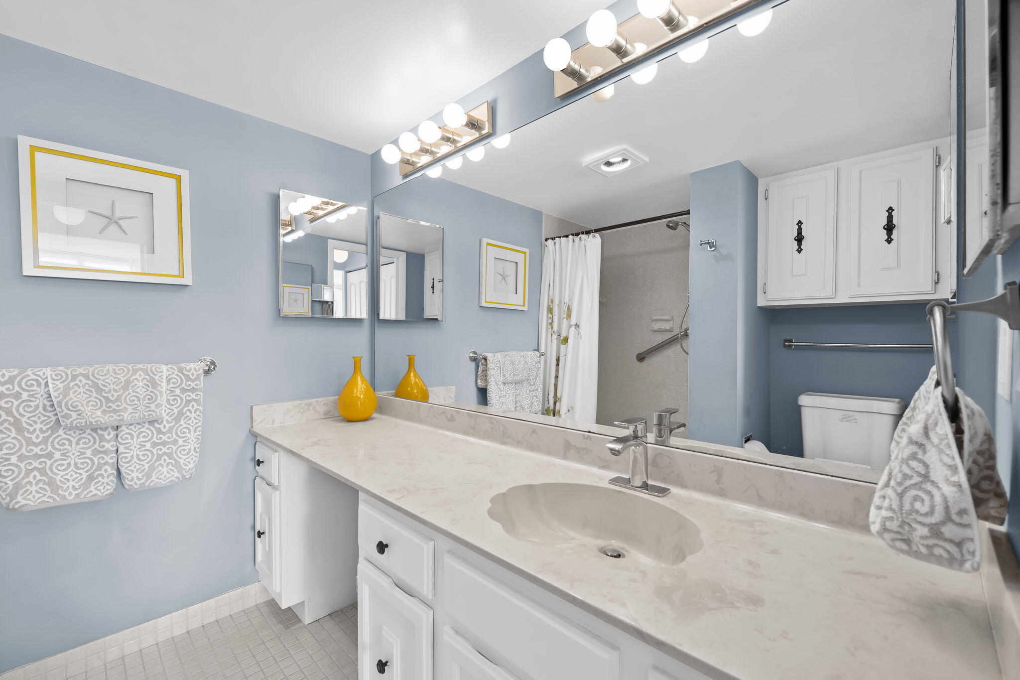 15 Royal Palm Way, Unit 505 Boca Raton, FL 33432 - Photo 14 of 32 a bathroom with a sink and a mirror