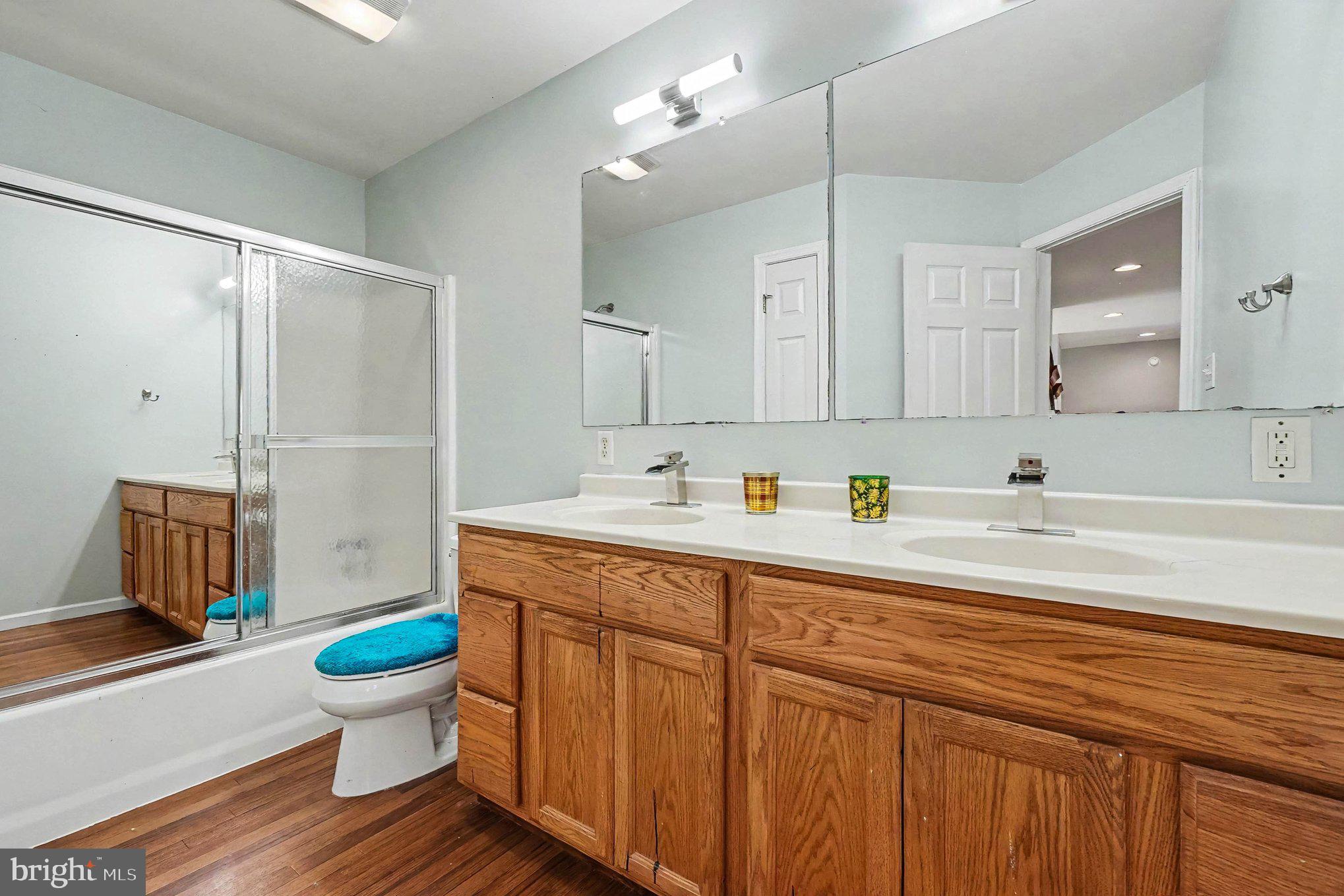 64 Open Meadow Court Elkton, MD 21921 - Photo 39 of 57 a bathroom with a sink toilet a mirror and shower