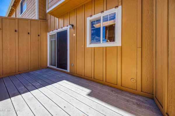 a front view of a house with a yard and outdoor seating